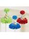 3 coni con pompon pendenti di pois a colori