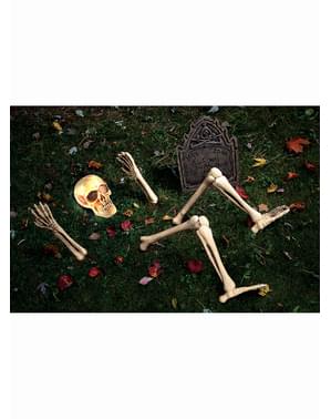 Figura decorativa scheletro che esce dalla tomba