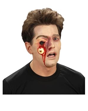 Prótesis de ojo colgando