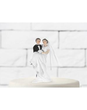 Figur kue pengantin dengan pengantin wanita di lengan