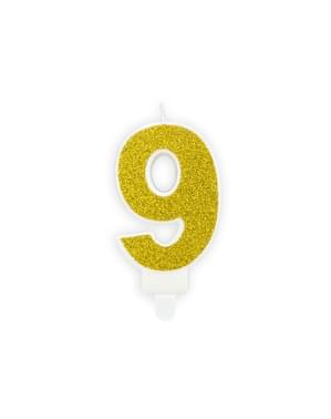 Number 9 birthday candle in gold