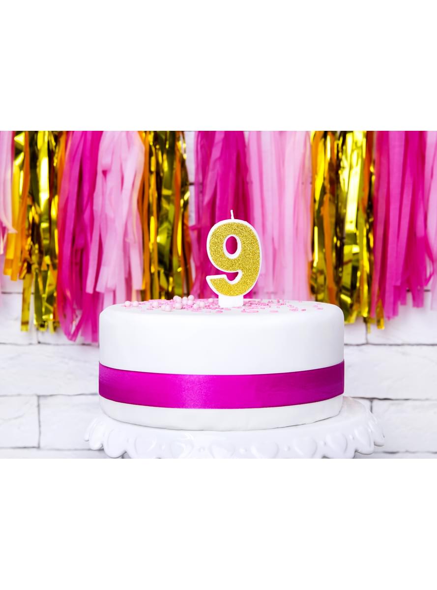 Number 9 birthday candle in gold