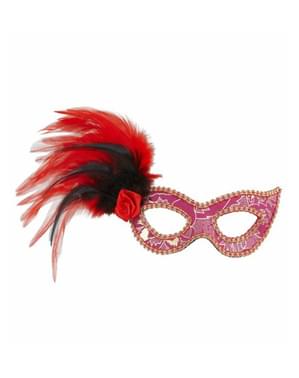 Masque rose avec fleurs et plumes