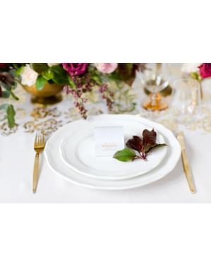 10 valkoista lahjalaatikkoa kultaisella 