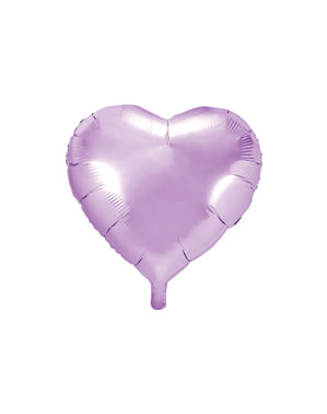 Foil balon dalam bentuk jantung dalam cahaya ungu