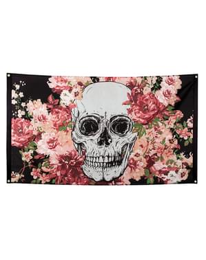 Banner af et skelet i sort og lyserød med blomster